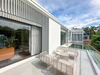 Modern balcony with outdoor seating and scenic view