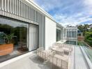 Modern balcony with outdoor seating and scenic view