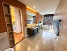 Modern bathroom with large bathtub, double sink vanity, and storage space