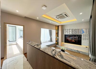 Modern living room with marble countertop and recessed lighting