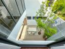 Top view of an outdoor patio with a dining table and chairs