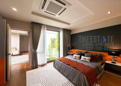 Modern bedroom with large window and stylish décor