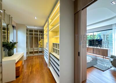 Modern bedroom with walk-in closet and natural lighting