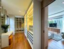 Modern bedroom with walk-in closet and natural lighting