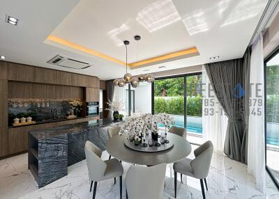 Modern kitchen and dining area with pool view