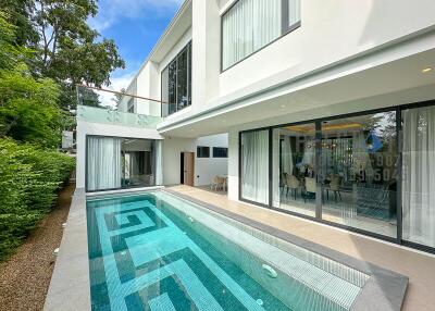 Modern house with glass doors and a swimming pool