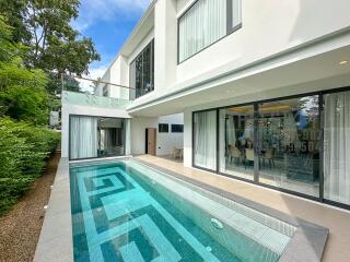 Modern house with glass doors and a swimming pool