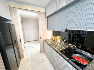 Modern kitchen with marble flooring and countertop