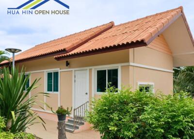 Single-story house exterior with tiled roof