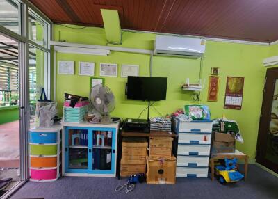 Bedroom with storage and mounted TV