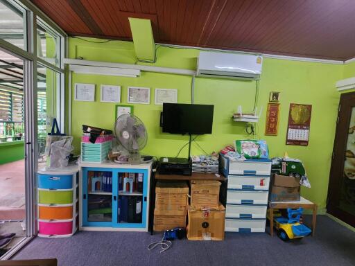 Bedroom with storage and mounted TV