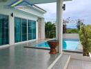 Outdoor space with pool and seating area