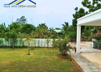 Front yard with greenery and driveway