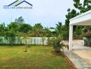 Front yard with greenery and driveway