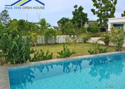 Outdoor view with pool and garden