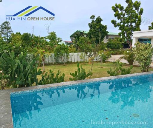 Outdoor view with pool and garden