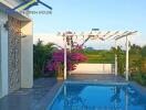 Lovely pool area with pergola and surrounding greenery