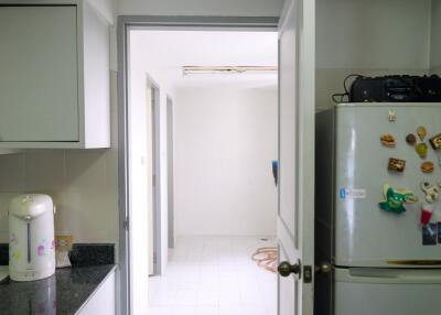 Modern kitchen with doorway to additional room or space