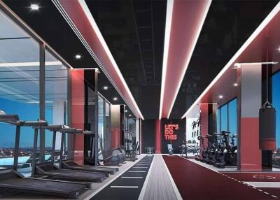 Modern fitness center with treadmills, exercise bikes, and a boxing area