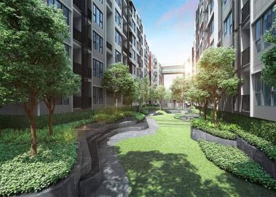 Outdoor garden area between modern apartment buildings