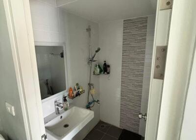 Modern bathroom with a walk-in shower and a white sink