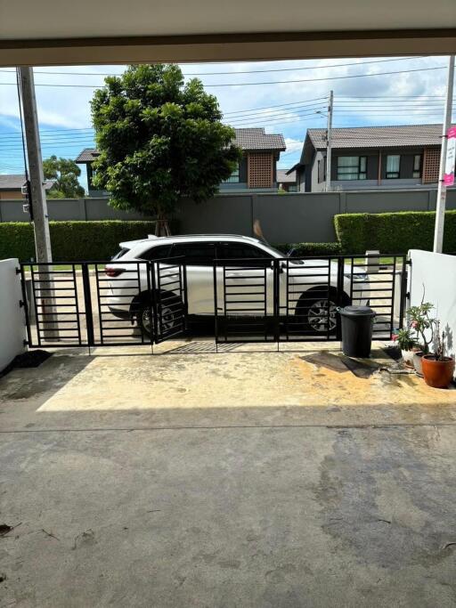 view of driveway and street from garage