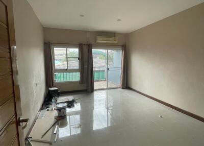 Unfurnished living room with large windows