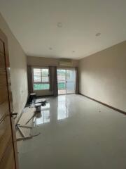 Unfurnished living room with large windows