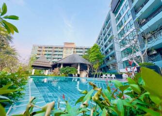 Luxury apartment complex with pool and garden