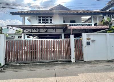 Front view of a house with a gated entrance