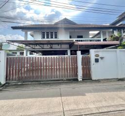 Front view of a house with a gated entrance