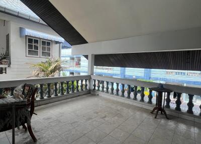 Spacious balcony with tiled floor and railings