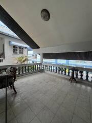 Spacious balcony with tiled floor and railings