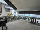 Spacious balcony with tiled floor and railings