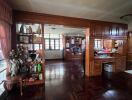 Spacious living room with wooden accents and large windows