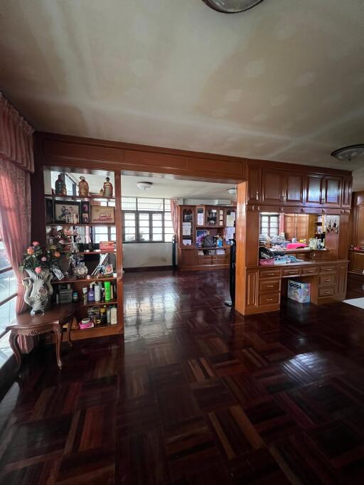 Spacious living room with wooden accents and large windows