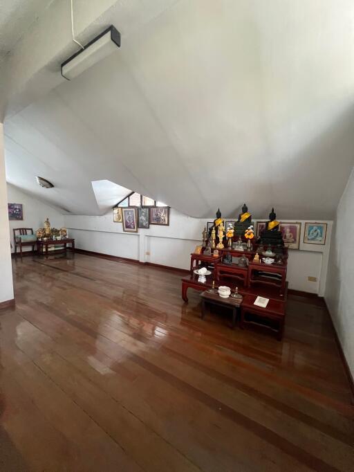 Spacious room with wooden floor and decor