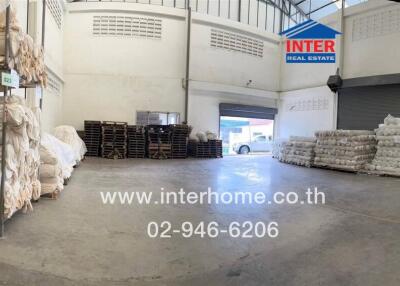 Indoor warehouse space with storage and loading areas