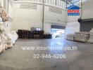 Indoor warehouse space with storage and loading areas