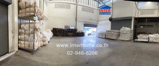 Indoor warehouse space with storage and loading areas