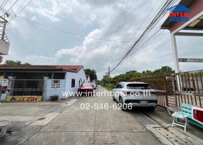 Exterior view of residential buildings with parked cars