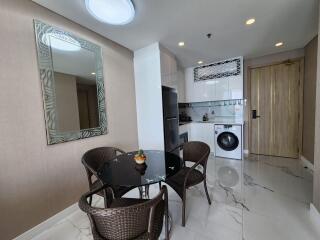 Modern kitchen and dining area with appliances