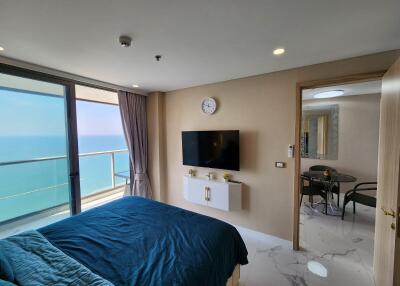 Bedroom with an ocean view and modern amenities