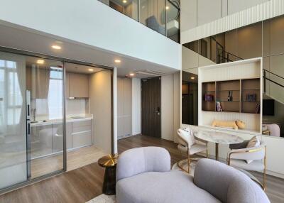 Spacious modern living area with open layout and stylish furniture