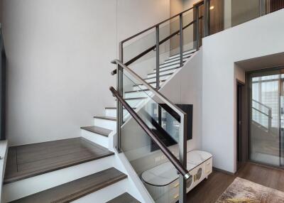 Modern living room with staircase and mezzanine