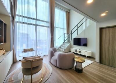 Modern living room with large windows and lofty ceilings