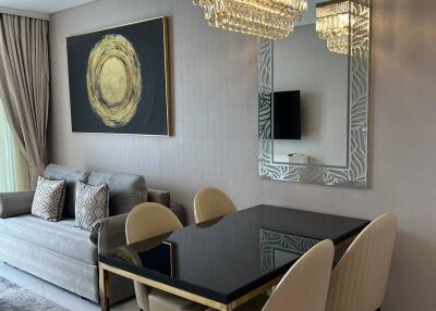 Stylish dining area with chandelier and modern decor