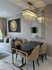 Stylish dining area with chandelier and modern decor