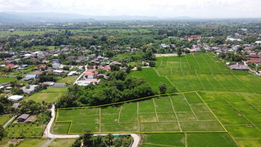 Aerial view of a land plot in a green rural area