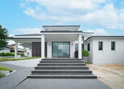 Modern exterior of a residential building with large entrance stairs